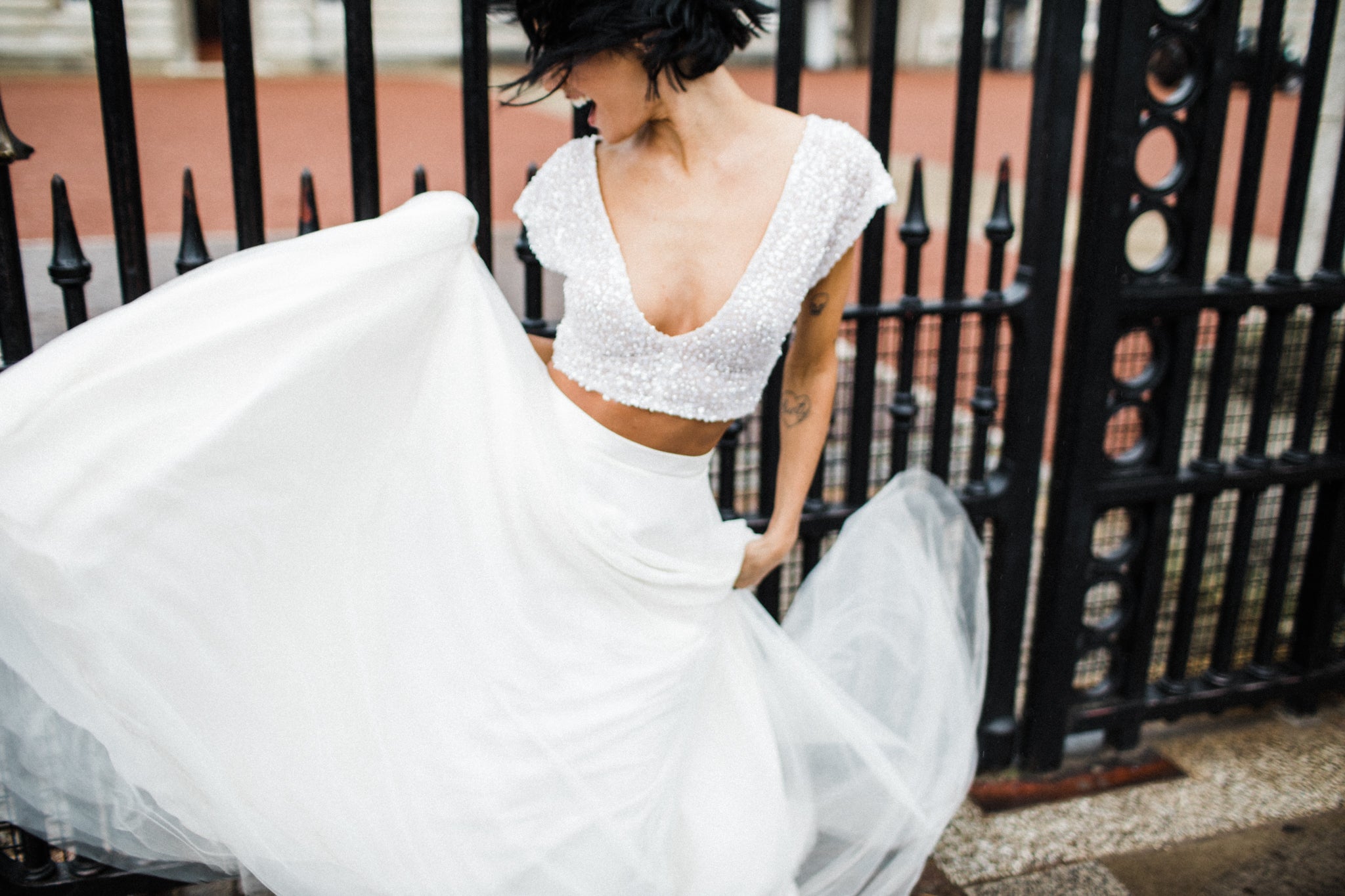 Model wears our Inca crop, a sequinned low plunge bridal top with open tulle tie back. Photo by Through The Woods We Ran