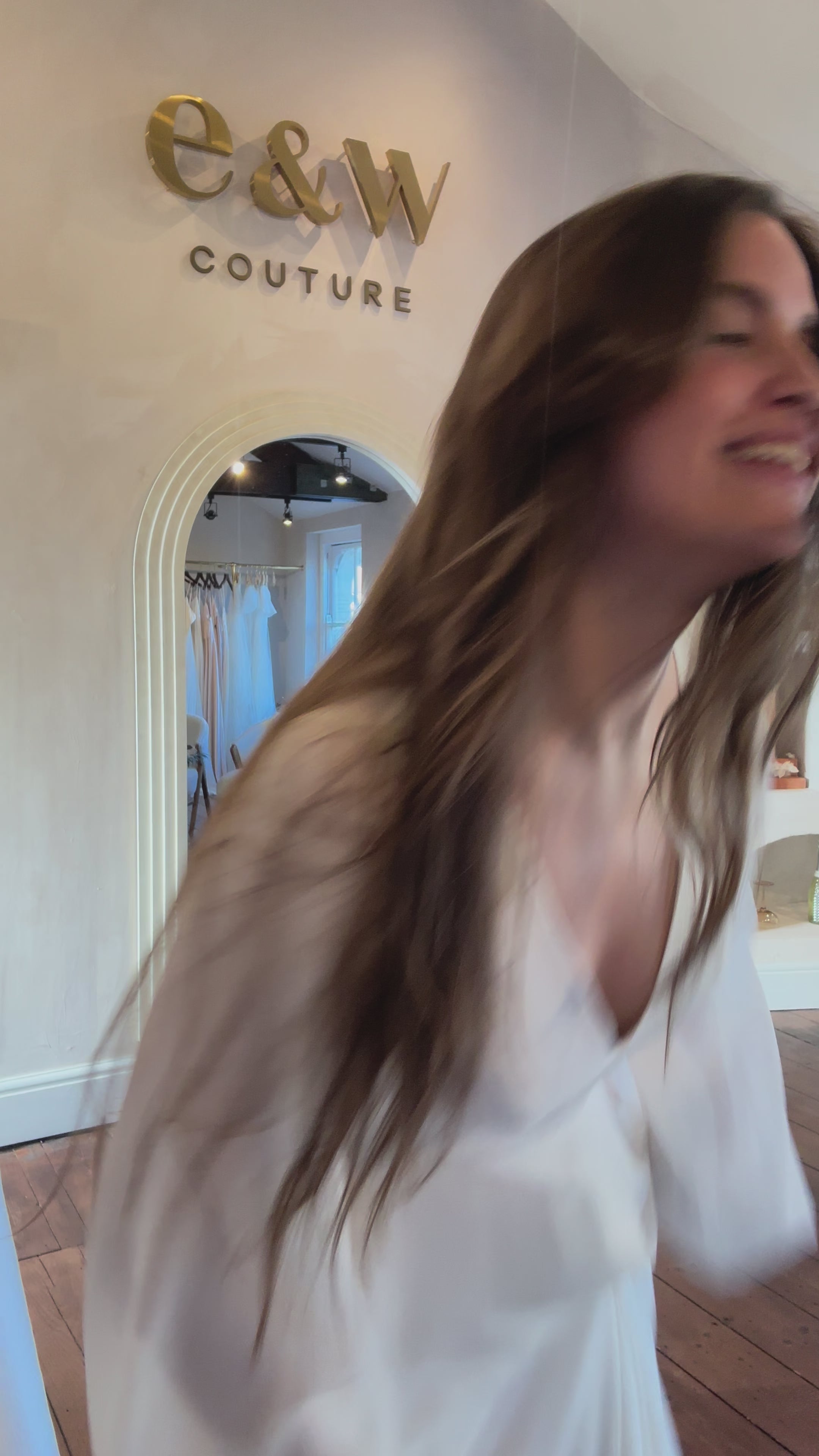 Model Video of our Savannah low plunge open back wedding dress showing pockets, movement in skirt and long sleeves.